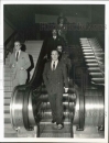 Prince Aly Khan rides escalator at United Nations building.  1958
